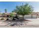 Charming single-story home showcasing a well-manicured front yard and a spacious two-car garage at 921 N Oxford Ln, Chandler, AZ 85225