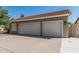 Two-car garage providing convenient parking and storage with a well-maintained exterior at 921 N Oxford Ln, Chandler, AZ 85225