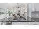 This view of the kitchen and living area shows an open layout with modern finishes and lots of light at 921 N Oxford Ln, Chandler, AZ 85225