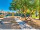 Outdoor common area with bike rack, cactus, seating, and a shaded walkway at 9733 W Mcrae Way, Peoria, AZ 85382