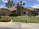 Charming home featuring a well-manicured lawn, mature trees, and a tile roof in a desirable neighborhood at 9733 W Mcrae Way, Peoria, AZ 85382