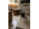 Well-lit kitchen and dining area, featuring an island, stainless steel appliances, and a modern chandelier at 9733 W Mcrae Way, Peoria, AZ 85382