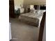 Cozy main bedroom with a comfortable bed, built-in storage, and soft carpeting at 9733 W Mcrae Way, Peoria, AZ 85382