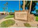 The Lakes Golf Course & Restaurant entrance sign with lush greenery and a clear sky at 9733 W Mcrae Way, Peoria, AZ 85382