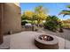 Outdoor kitchen and firepit offer a perfect spot for outdoor dining and entertaining at 9913 E Quarry Trl, Scottsdale, AZ 85262