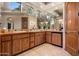 Spacious bathroom featuring double sinks, decorative tile, and custom cabinets at 9913 E Quarry Trl, Scottsdale, AZ 85262