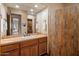 Bathroom featuring a built-in sink, tiled countertops, and an enclosed shower-tub combination at 9913 E Quarry Trl, Scottsdale, AZ 85262