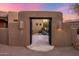Beautiful front gate offering an inviting entrance to a courtyard with lush desert landscaping at 9913 E Quarry Trl, Scottsdale, AZ 85262