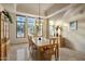 Bright dining room with large decorative windows and classic design at 9913 E Quarry Trl, Scottsdale, AZ 85262