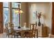Elegant dining room featuring decorative windows and chandelier lighting at 9913 E Quarry Trl, Scottsdale, AZ 85262