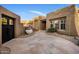 Inviting desert home with a grand entrance and decorative succulent fountain feature at 9913 E Quarry Trl, Scottsdale, AZ 85262