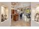 Open kitchen concept with bar seating, decorative lighting, and view of dining area at 9913 E Quarry Trl, Scottsdale, AZ 85262