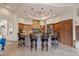 Spacious kitchen with a large center island, custom cabinetry, and modern appliances at 9913 E Quarry Trl, Scottsdale, AZ 85262