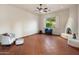 Large living room with tile flooring, fireplace, a comfortable chair, and lots of open space at 9913 E Quarry Trl, Scottsdale, AZ 85262