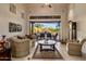 Spacious living room with patio access creating a seamless indoor/outdoor living experience at 9913 E Quarry Trl, Scottsdale, AZ 85262