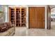 Bright living room with built-in shelving and sliding doors, offering an open and airy feel at 9913 E Quarry Trl, Scottsdale, AZ 85262