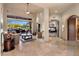Open living room layout leading to a bedroom suite and offering patio access at 9913 E Quarry Trl, Scottsdale, AZ 85262