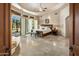Large main bedroom featuring recessed ceiling and private patio access at 9913 E Quarry Trl, Scottsdale, AZ 85262