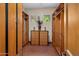 Spacious walk-in closet features built-in shelving, dresser and natural light from the two windows at 9913 E Quarry Trl, Scottsdale, AZ 85262