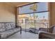 Balcony with outdoor seating that overlooks the parking area and landscaping at 10330 W Thunderbird Blvd # A209, Sun City, AZ 85351
