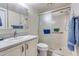 Bathroom with a tiled shower, white vanity, and grey countertop at 10330 W Thunderbird Blvd # A209, Sun City, AZ 85351