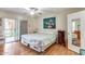 Bedroom with a ceiling fan, laminate floors, and sliding glass door at 10330 W Thunderbird Blvd # A209, Sun City, AZ 85351