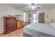 Bedroom with a ceiling fan, laminate floors, and sliding glass door at 10330 W Thunderbird Blvd # A209, Sun City, AZ 85351