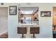 Eat in kitchen featuring modern appliances, counter seating and wood cabinets at 10330 W Thunderbird Blvd # A209, Sun City, AZ 85351