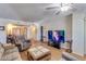 Living room with wood floors and ceiling fan, offering comfortable seating and entertainment at 10330 W Thunderbird Blvd # A209, Sun City, AZ 85351