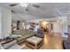Cozy living room featuring hardwood floors, a ceiling fan, and comfortable seating arrangements at 10330 W Thunderbird Blvd # A209, Sun City, AZ 85351