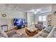 Cozy living room features a ceiling fan and ample natural light from a window at 10330 W Thunderbird Blvd # A209, Sun City, AZ 85351