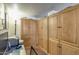 A charming office space featuring custom wood cabinets and ample storage at 10330 W Thunderbird Blvd # A209, Sun City, AZ 85351