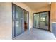 The cozy patio area features sliding glass doors with views of the outdoor scenery at 10330 W Thunderbird Blvd # A209, Sun City, AZ 85351