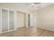 Bedroom with wood floors and a walk-in closet at 13052 W Mine Trl, Peoria, AZ 85383