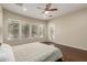 Bright bedroom features a ceiling fan and a door to the outside at 13052 W Mine Trl, Peoria, AZ 85383