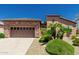 Charming single-story home with a two-car garage, desert landscaping, and a well-maintained yard at 13052 W Mine Trl, Peoria, AZ 85383