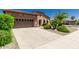 Well maintained front yard with a two car garage and desert landscaping in a desert climate at 13052 W Mine Trl, Peoria, AZ 85383