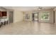 Open floor plan with neutral tile flooring, dining area, and access to the kitchen at 13052 W Mine Trl, Peoria, AZ 85383