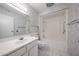 Traditional bathroom with butterfly wallpaper, white vanity, toilet, and shower-tub combo at 13618 N 98Th Ave # C, Sun City, AZ 85351