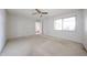 Bedroom with carpet, window for natural light, closet, and doorway to another room at 13618 N 98Th Ave # C, Sun City, AZ 85351