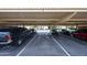 A covered parking area shows multiple vehicles parked in designated spots at 13618 N 98Th Ave # C, Sun City, AZ 85351