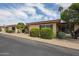 Charming single-story home featuring desert landscaping, a gated entryway, and lovely curb appeal at 13618 N 98Th Ave # C, Sun City, AZ 85351