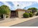 Charming single-story home featuring desert landscaping, a gated entryway, and lovely curb appeal at 13618 N 98Th Ave # C, Sun City, AZ 85351