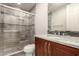 This bathroom features granite counters, tile surround and modern fixtures at 14674 W Pasadena Ave, Litchfield Park, AZ 85340