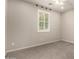 Bright bedroom with plantation shutters and plush carpet flooring at 14674 W Pasadena Ave, Litchfield Park, AZ 85340