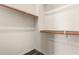 This walk-in closet provides ample storage with double-hung rods at 14674 W Pasadena Ave, Litchfield Park, AZ 85340