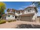 Inviting two-story home boasting a brick driveway, spacious two-car garage, and elegant architectural details at 14674 W Pasadena Ave, Litchfield Park, AZ 85340