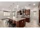 Open concept kitchen with a large island, stainless steel appliances, and a modern design at 14674 W Pasadena Ave, Litchfield Park, AZ 85340