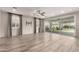 Spacious living room featuring tile floors, large windows, and sliding glass doors for ample natural light at 14674 W Pasadena Ave, Litchfield Park, AZ 85340