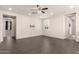 Spacious living room features neutral paint, a ceiling fan and recessed lighting at 14674 W Pasadena Ave, Litchfield Park, AZ 85340